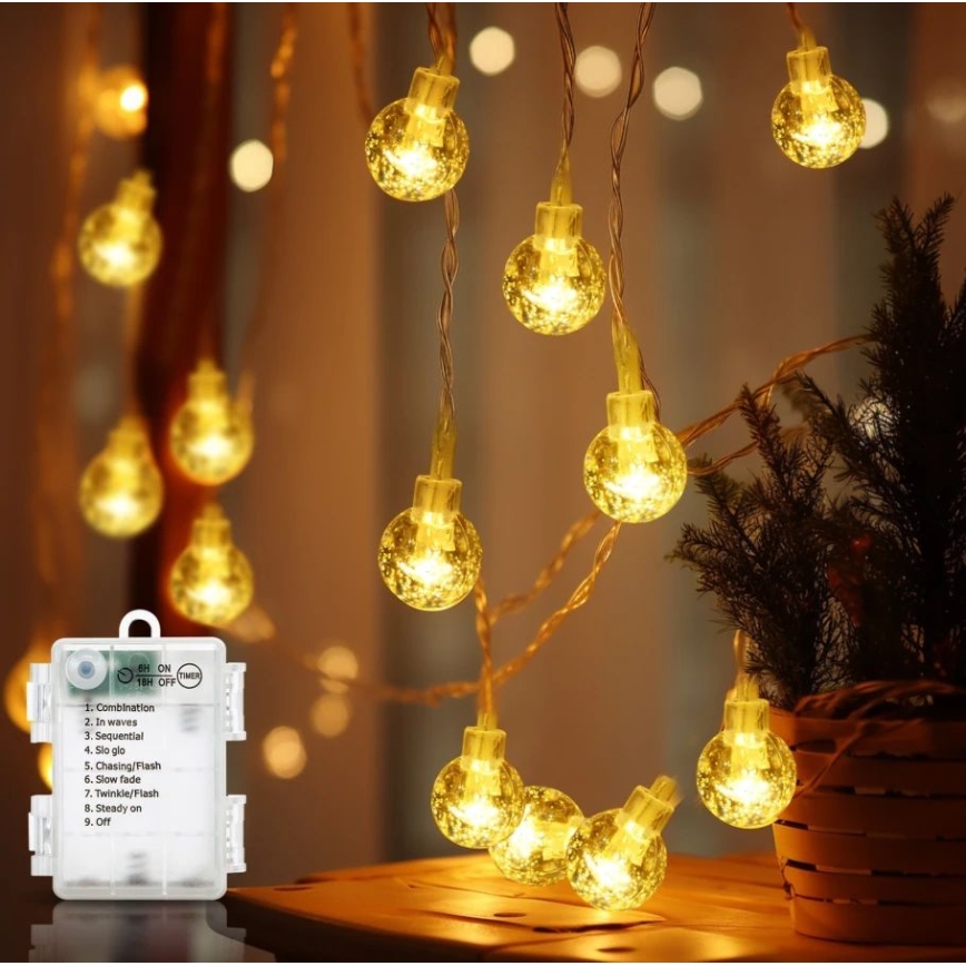 Aigostar - LED Kerst lichtsnoer voor buiten 100xLED/3xAA/8 Functies 10,3 m IP44 warm wit